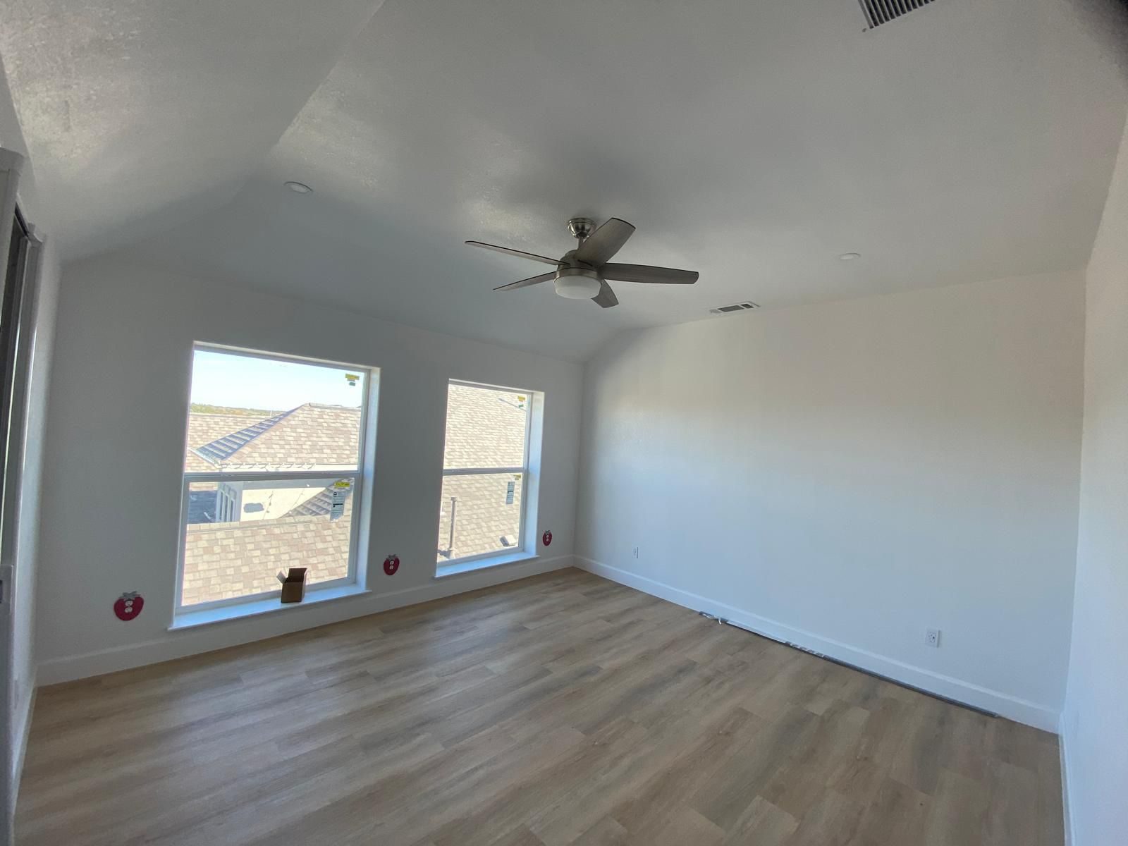 Remodeled Austin interior with wood floors, vaulted ceiling and large windows